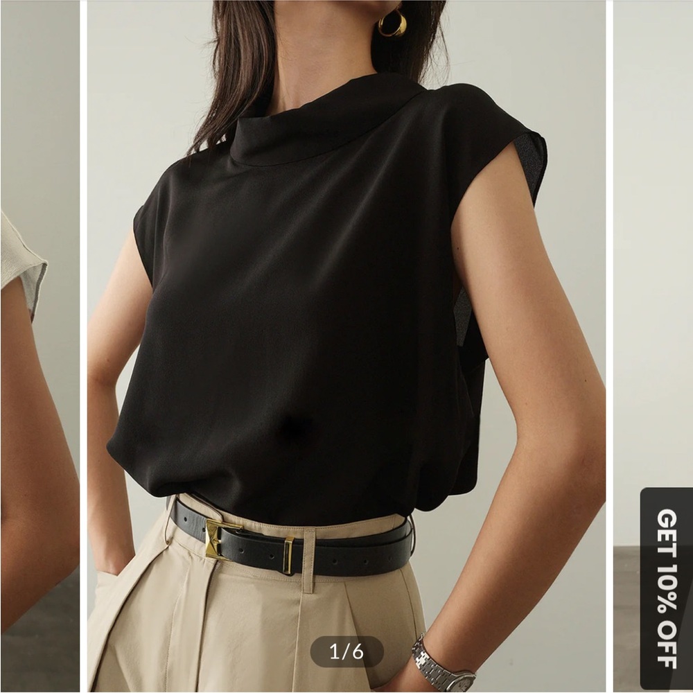 Dress this cap sleeve black blouse up or down. Great for work or the weekend